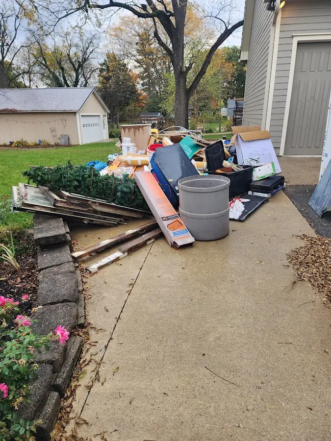 Dumpster being loaded with debris for 3 Yard Dumpster Rental in Lake Lorraine